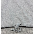 Second Half Supply Co, LLC heather gray cropped sweatshirt featuring an adjustable drawstring hem detail.