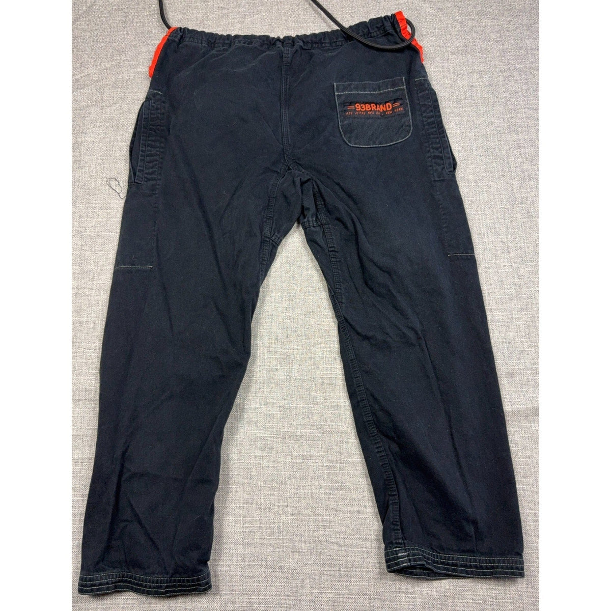 Second Half Supply Co, LLC 93brand black gi-style lounge pants with orange drawstring and rear embroidered pocket