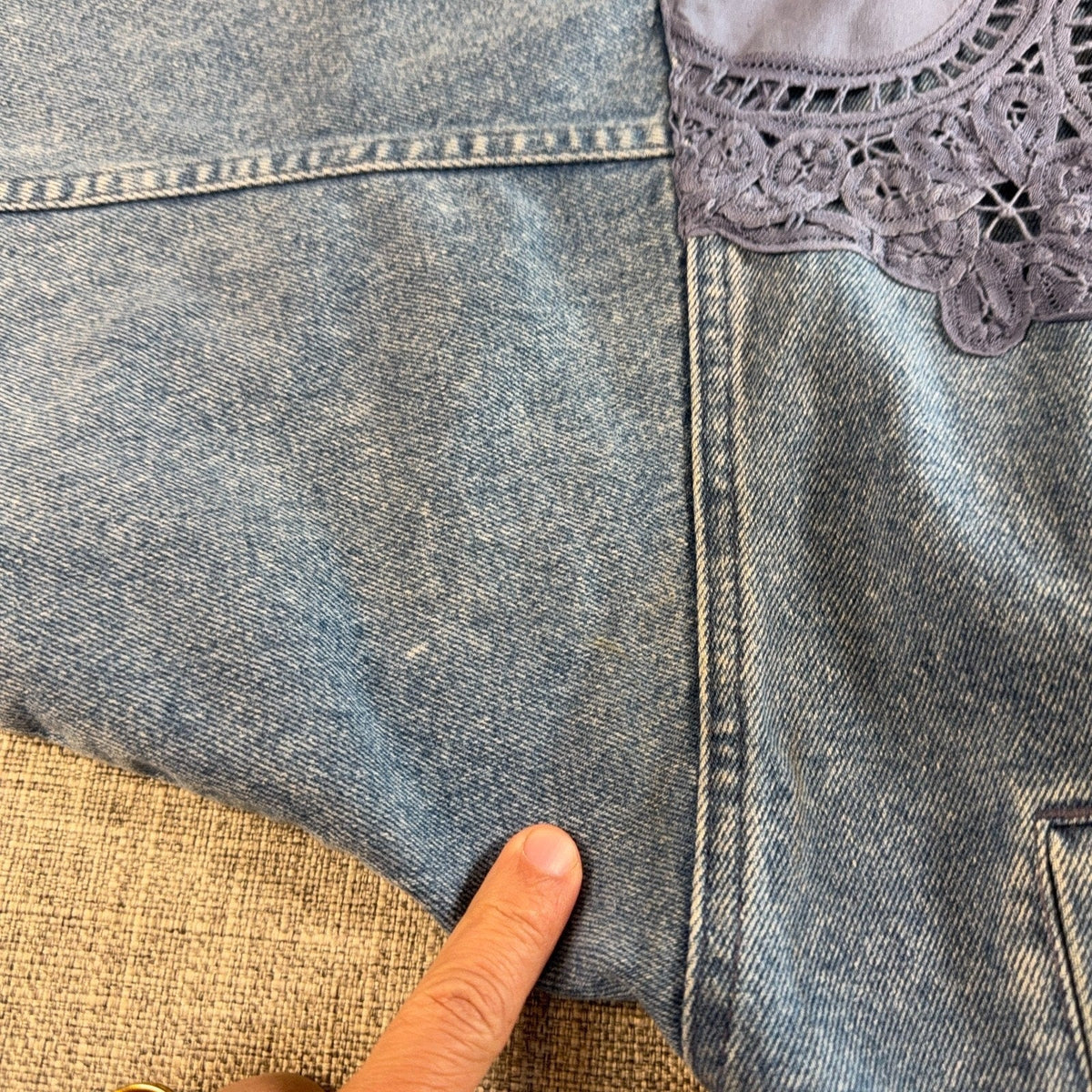 Second Half Supply Co, LLC vintage acid wash denim jacket detail showing faint discoloration and lavender lace yoke