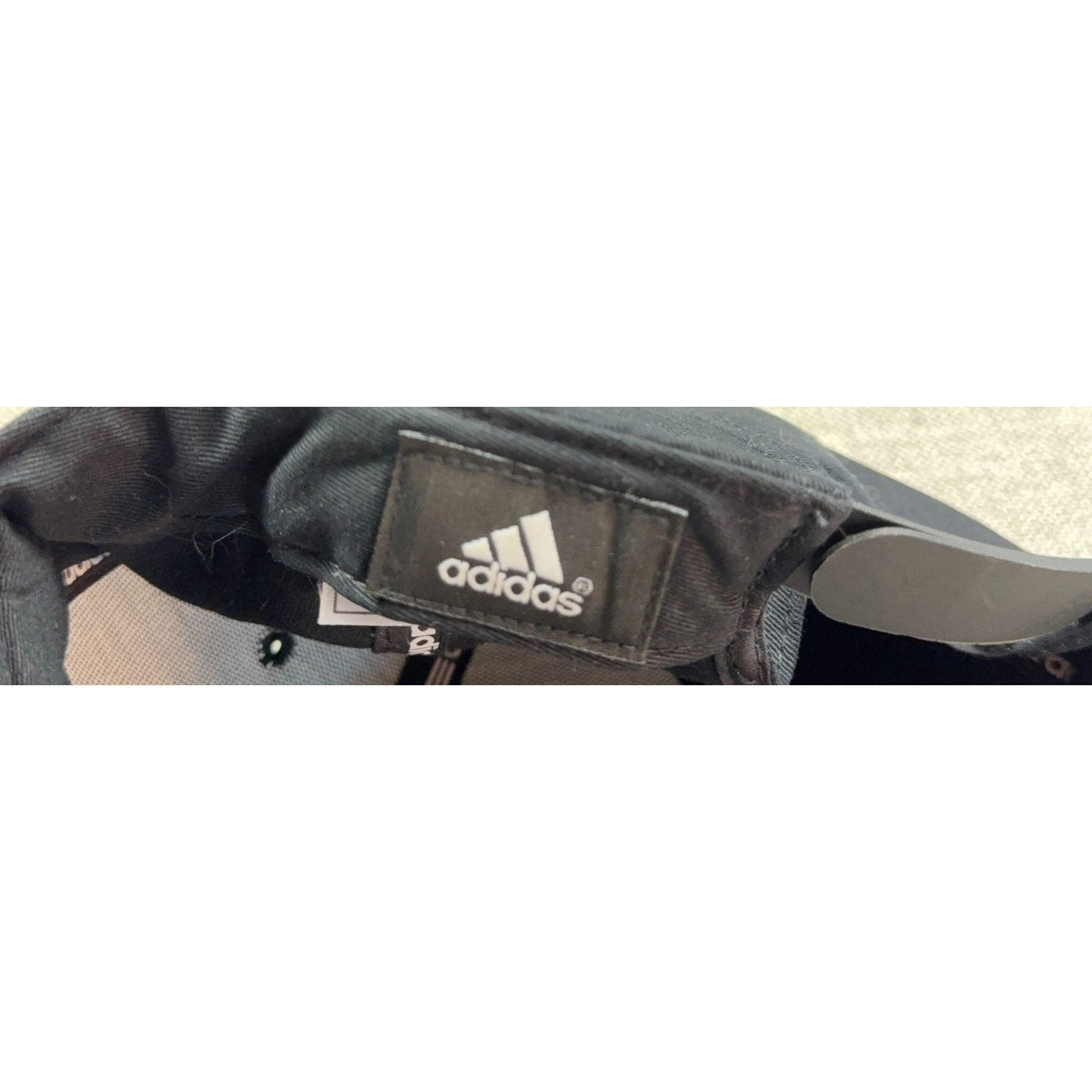 Second Half Supply Co, LLC black Adidas snapback hat interior label and adjustable strap detail