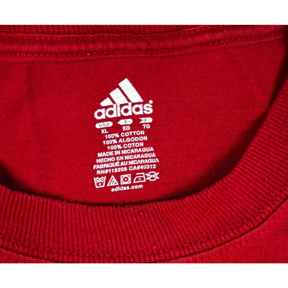 Second Half Supply Co, LLC red Adidas cotton t-shirt interior neck label with size XL and care instructions