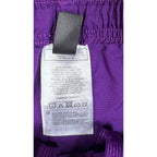Second Half Supply Co, LLC purple Adidas soccer shorts interior care tag with manufacturing details in Cambodia