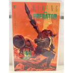 Second Half Supply Co, LLC Aliens vs Predator #1 comic book by Dark Horse with vibrant orange cover art
