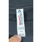 Second Half Supply Co, LLC Alstyle brand tag on a black cotton-blend sweatshirt showing size Medium and origin