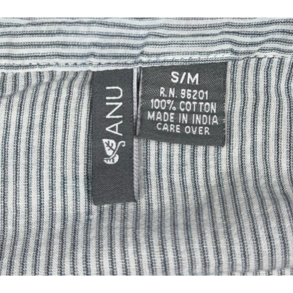 Second Half Supply Co, LLC ANU blouse fabric tag showing 100% cotton material and S/M size on blue-gray striped fabric