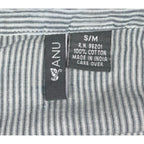 Second Half Supply Co, LLC ANU blouse fabric tag showing 100% cotton material and S/M size on blue-gray striped fabric