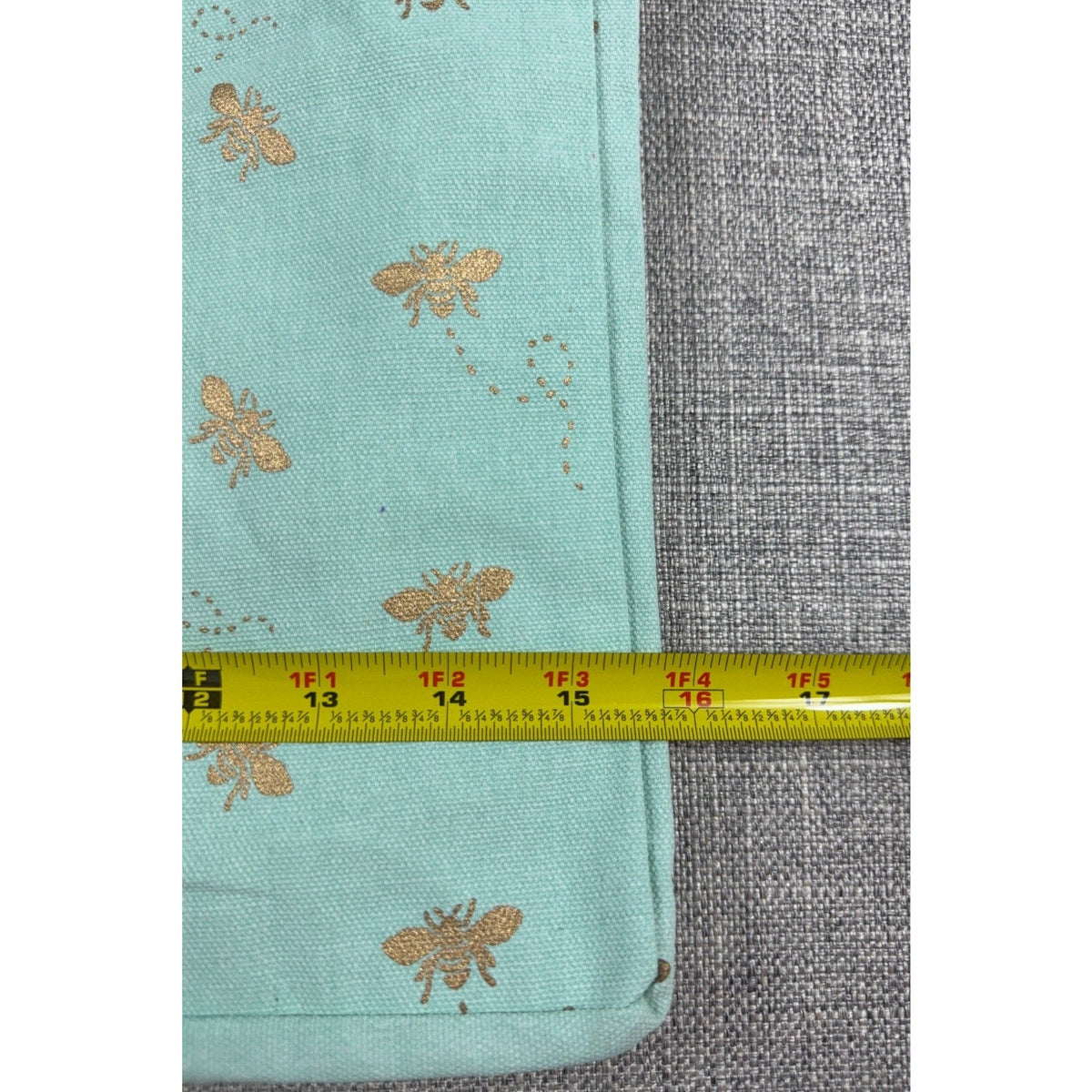 Second Half Supply Co, LLC aqua canvas tote bag with metallic gold bee print and measuring tape showing width