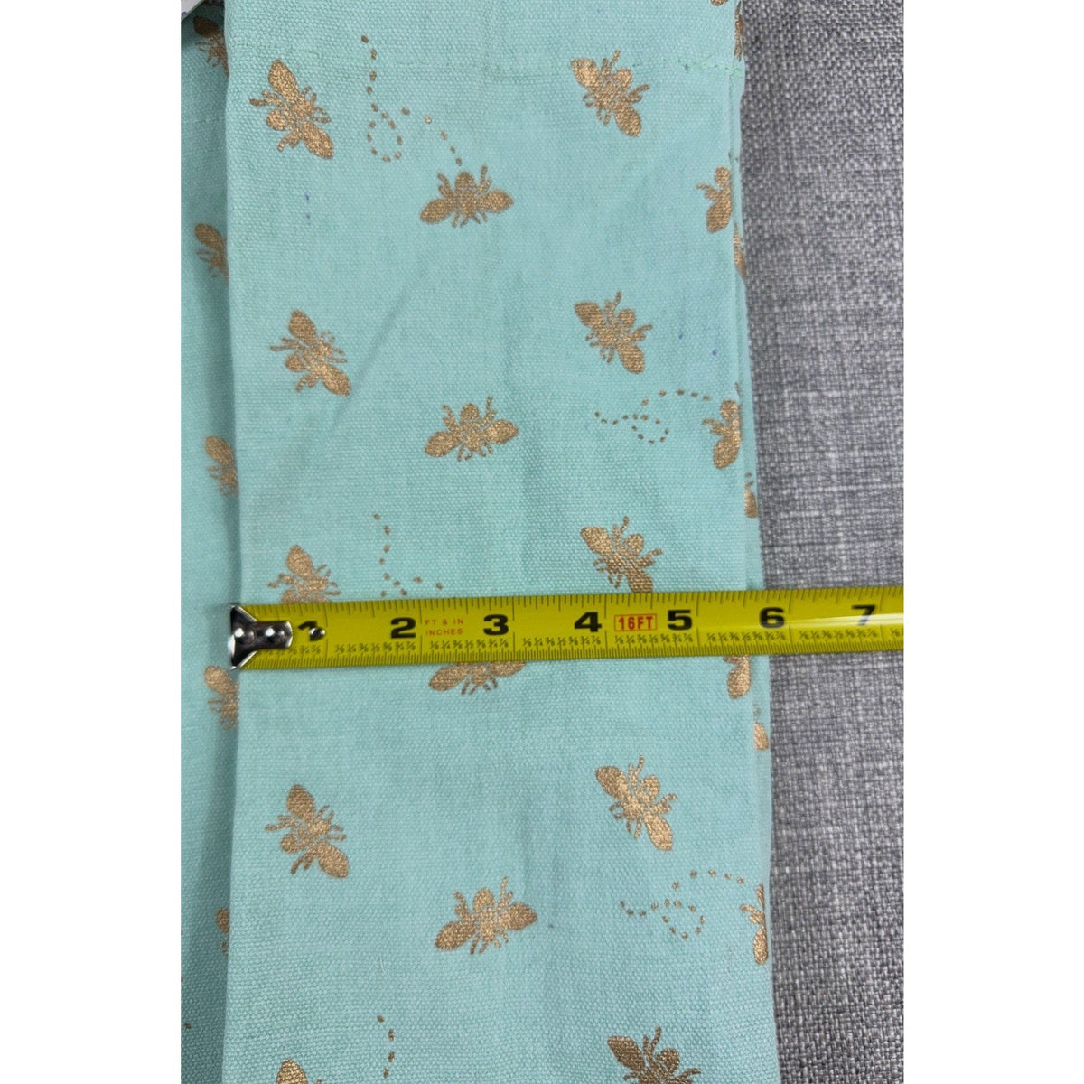 Second Half Supply Co, LLC aqua canvas tote with metallic gold bee print and measuring tape showing scale