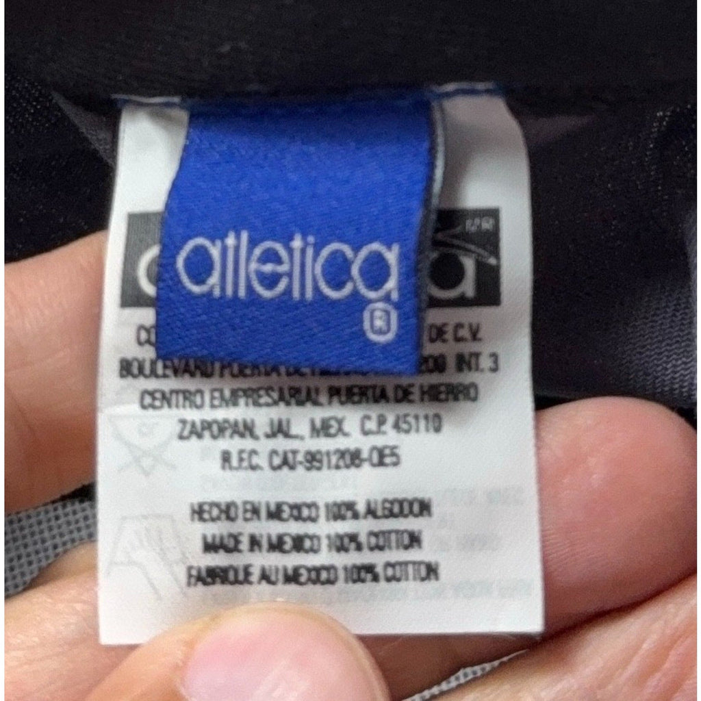 Second Half Supply Co, LLC tag on a vintage Atletica Club Necaxa soccer cap made of 100% cotton in Mexico