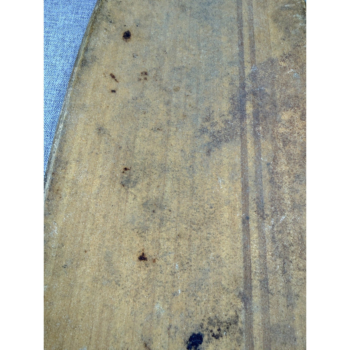 Close-up of the worn clear grip tape on a Second Half Supply Co, LLC Sector 9 bamboo longboard deck
