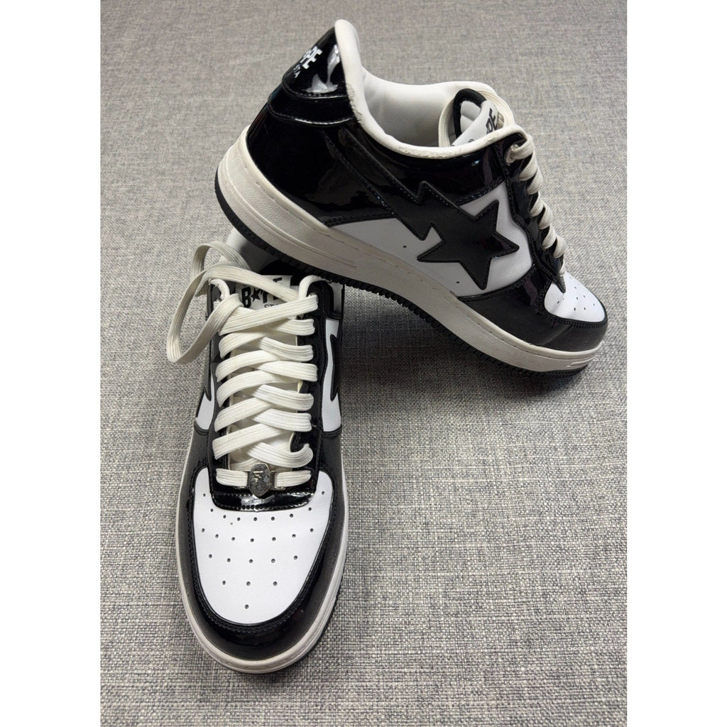 Second Half Supply Co, LLC black and white patent leather BAPE STA low-top sneakers with star logo and silver lace charm