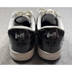 Second Half Supply Co, LLC black and white patent leather BAPE STA low-top sneakers, rear view showing heel branding.