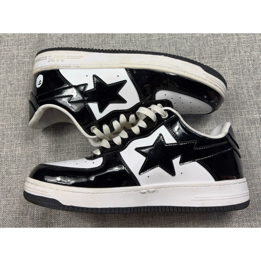 Second Half Supply Co, LLC BAPE STA low-top sneakers in black and white glossy patent leather with star side logos.