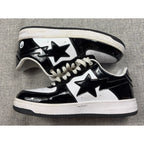 Second Half Supply Co, LLC BAPE STA low-top sneakers in black and white glossy patent leather with star side logos.