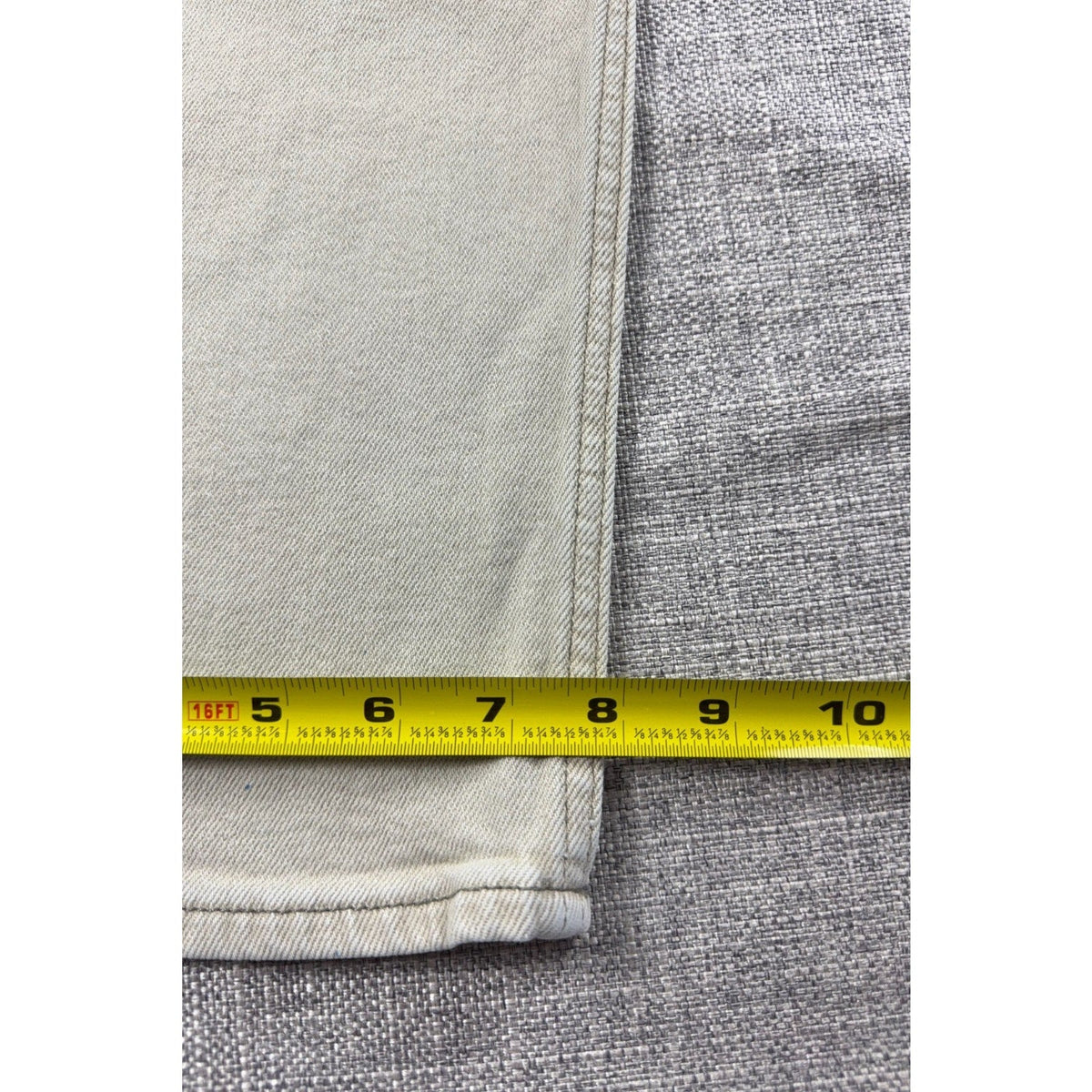 Second Half Supply Co, LLC light beige carpenter jeans leg with measuring tape showing length