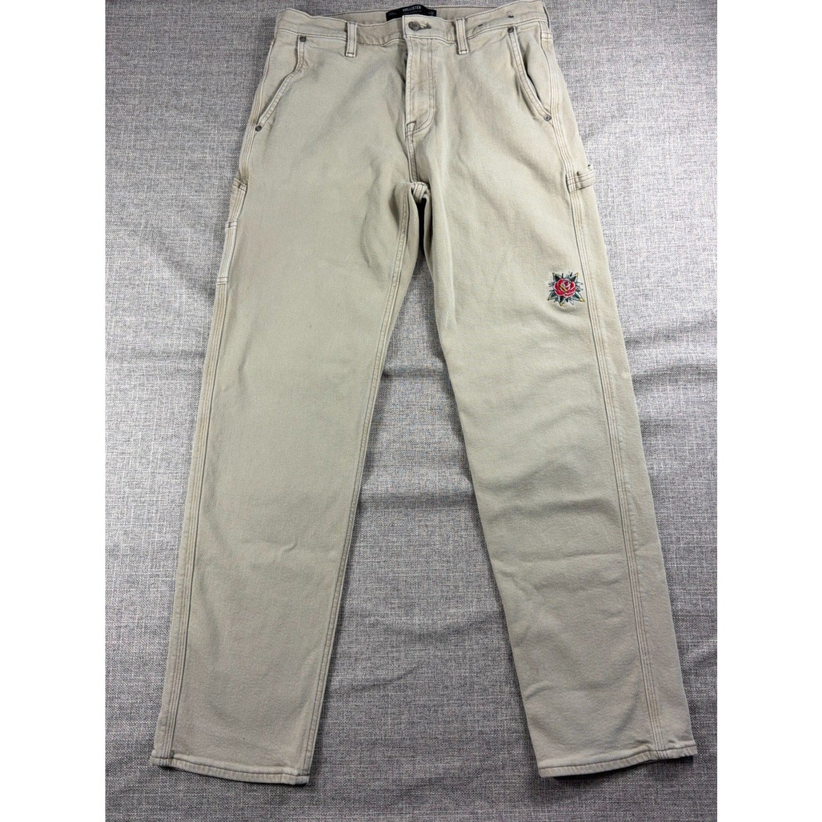 Second Half Supply Co, LLC beige Hollister carpenter jeans with custom American Traditional rose embroidery on the leg