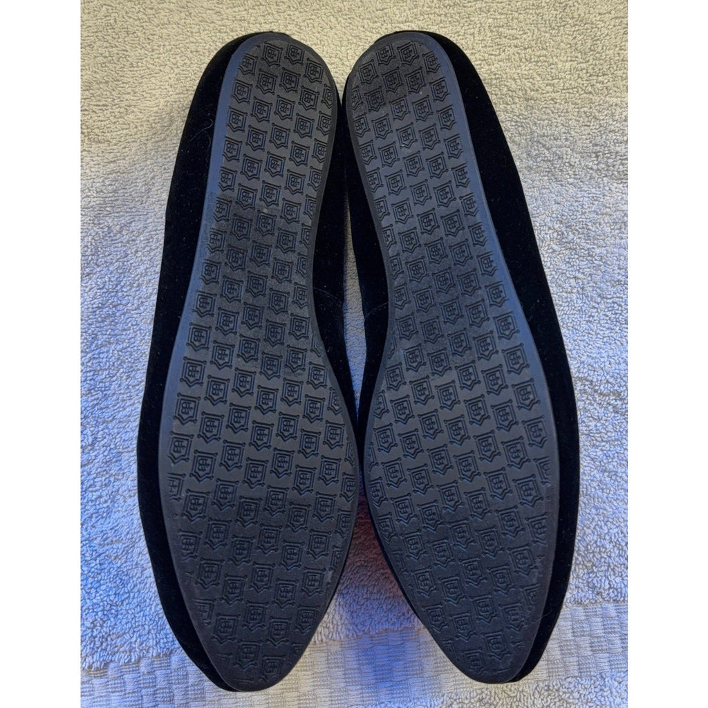 Second Half Supply Co, LLC Birdies black velvet flats showing the black rubber outsoles with a repeating logo pattern.