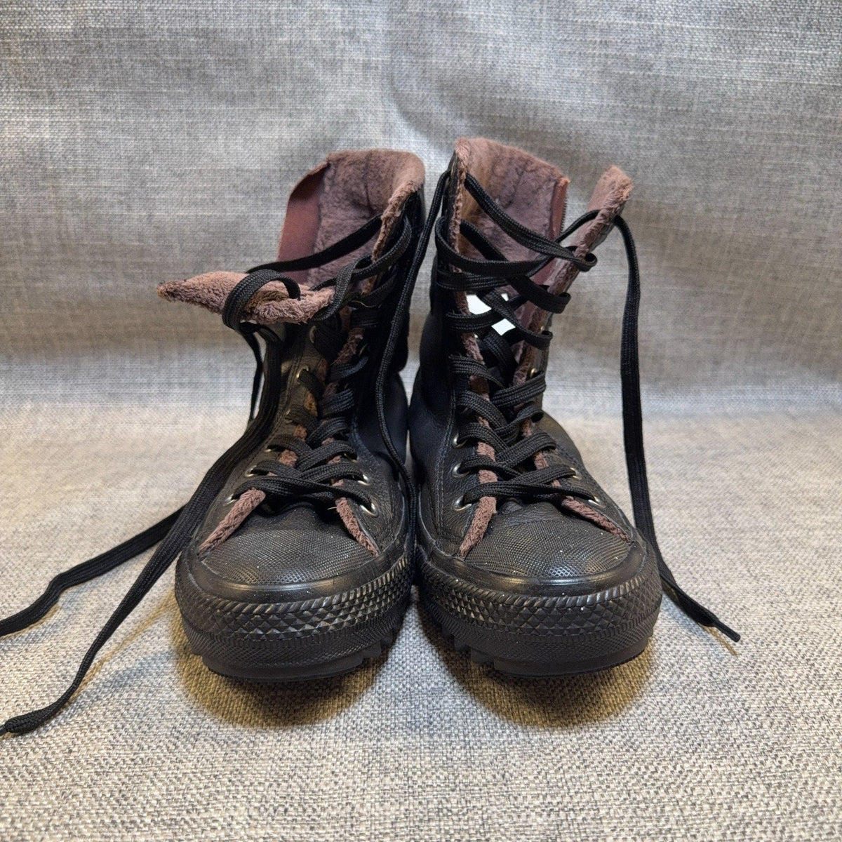 Second Half Supply Co, LLC black leather Converse Chuck Taylor hi-rise boots with brown faux-fur lining and laces
