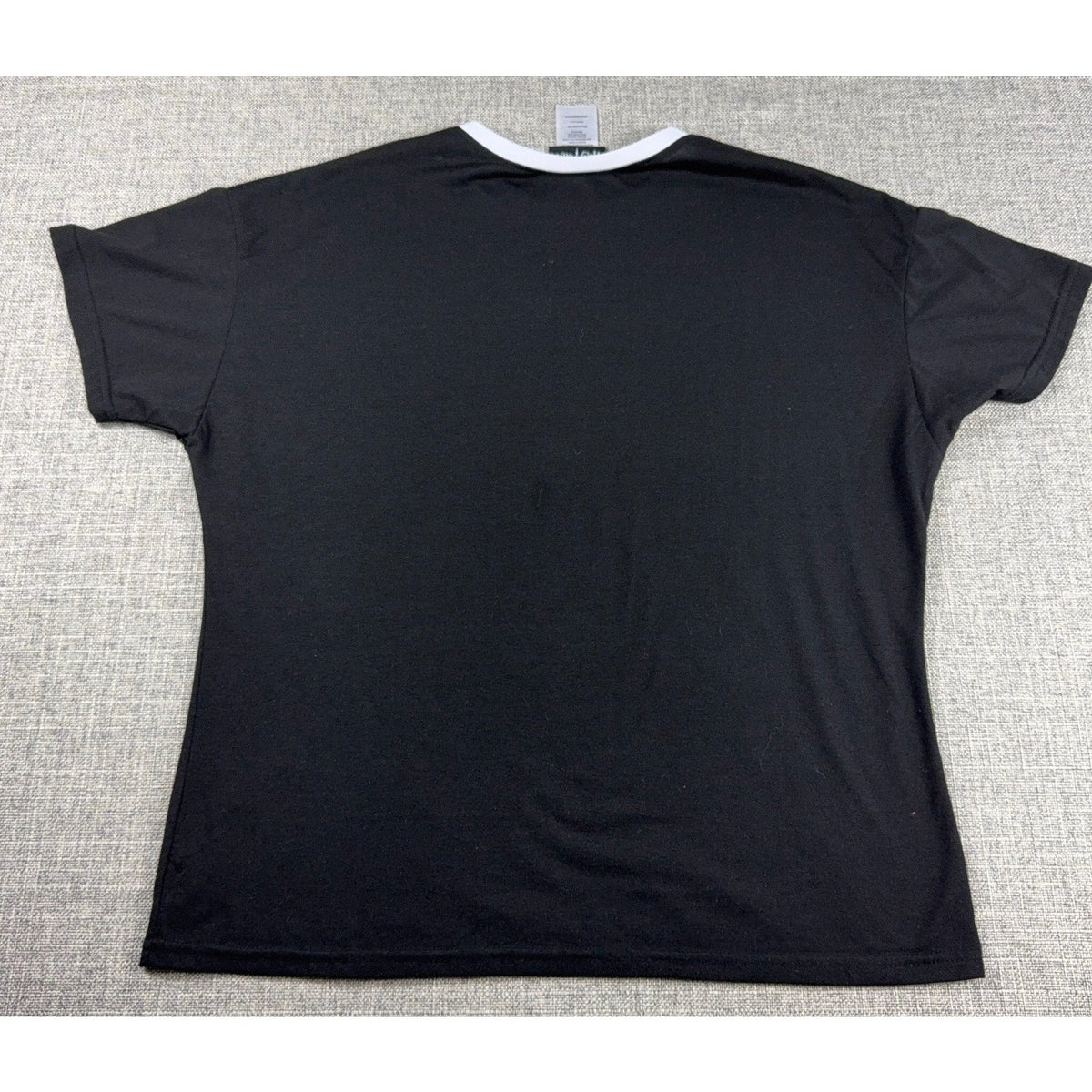 Back view of a black Second Half Supply Co, LLC Harry Potter ringer t-shirt with a contrasting white collar.