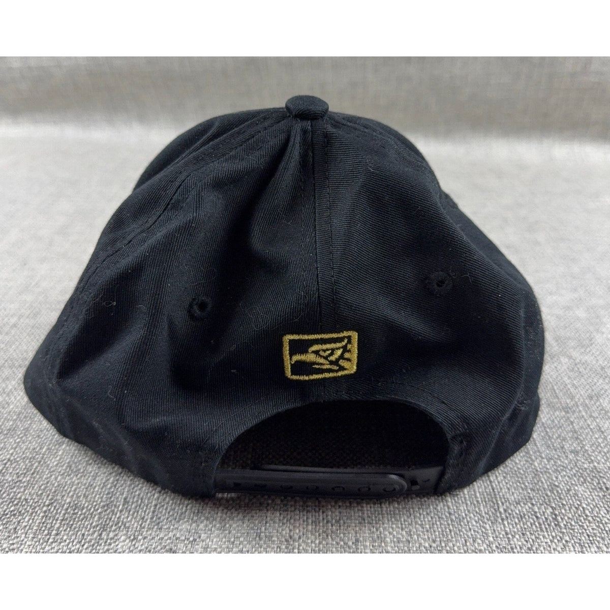 Second Half Supply Co, LLC black cotton snapback hat with gold embroidered eagle logo on the back adjustable strap