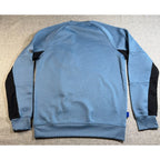 Back view of Second Half Supply Co, LLC blue and black colorblock crewneck sweatshirt with raglan sleeves