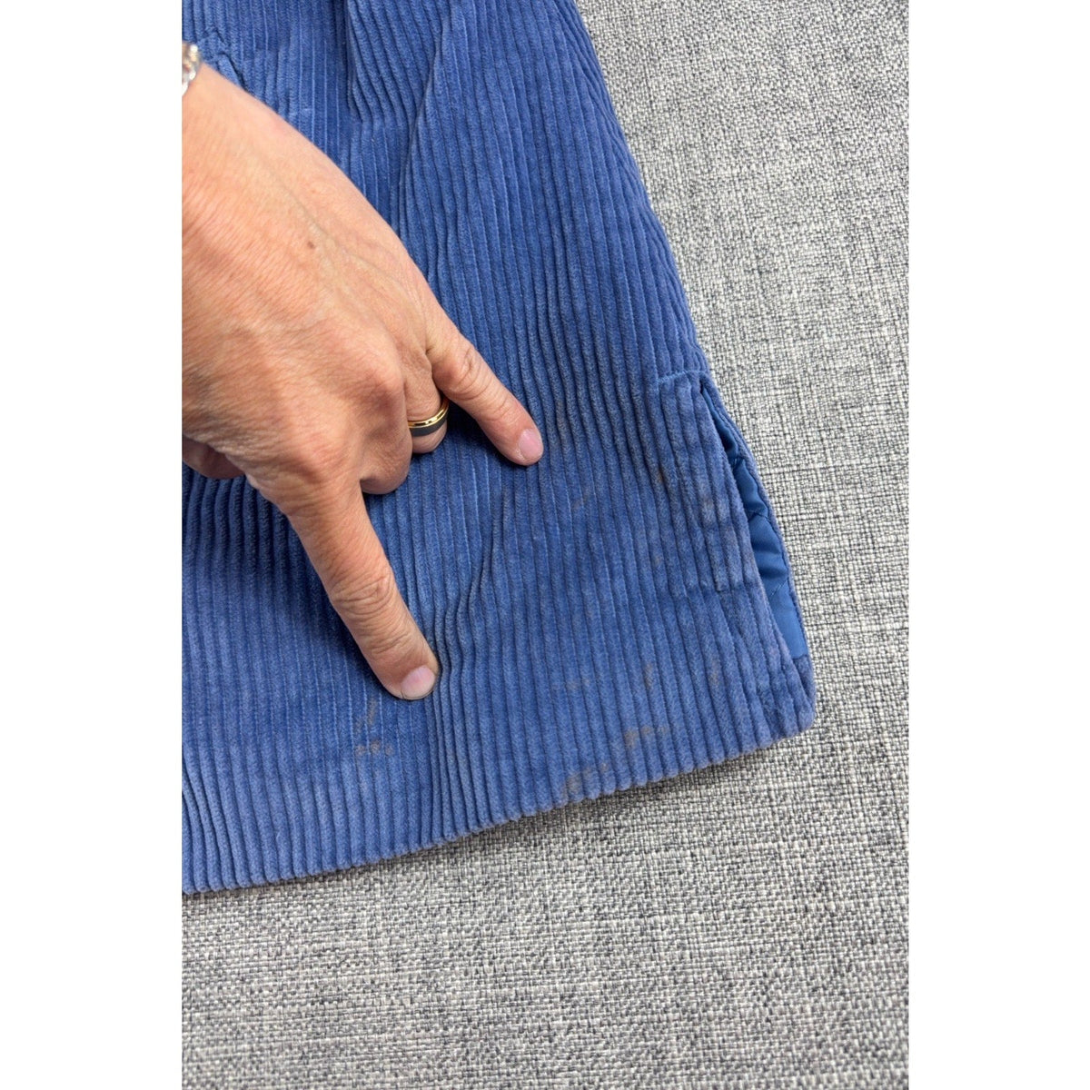 Second Half Supply Co, LLC blue wide-wale corduroy jacket showing fabric discoloration and staining near the pocket