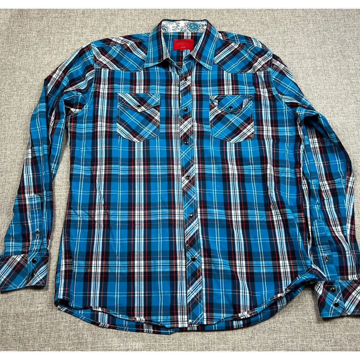 Second Half Supply Co, LLC men's blue plaid Western shirt with paisley trim, snap front, and dual chest pockets.