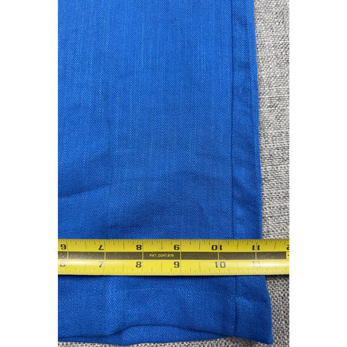 Second Half Supply Co, LLC electric blue wide-leg trousers with linen-feel texture being measured with a yellow tape.