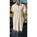 Second Half Supply Co, LLC blush pink midi shirt dress with button-front closure and short sleeves on a mannequin.