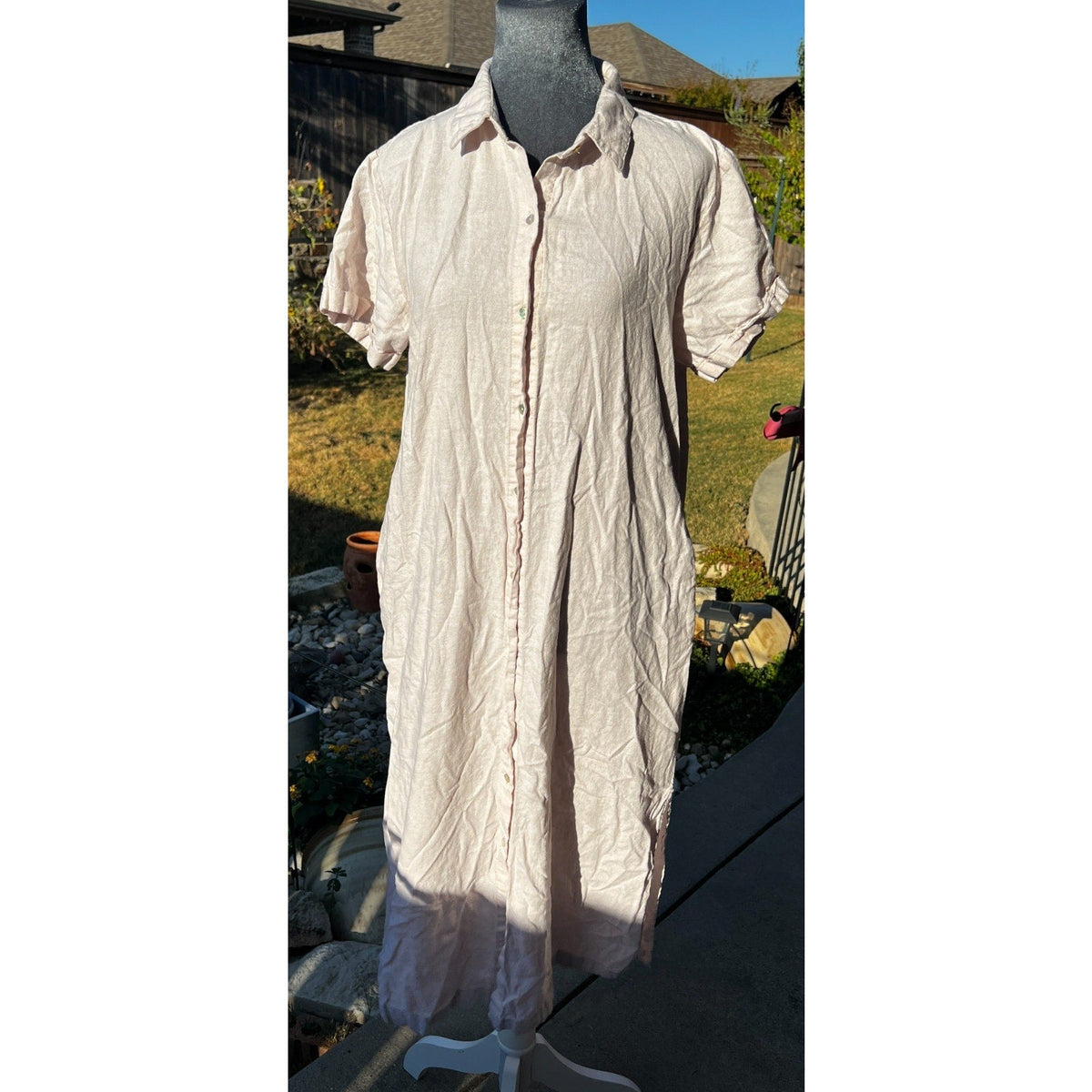 Second Half Supply Co, LLC blush pink midi shirt dress with button-front closure and short sleeves on a mannequin.