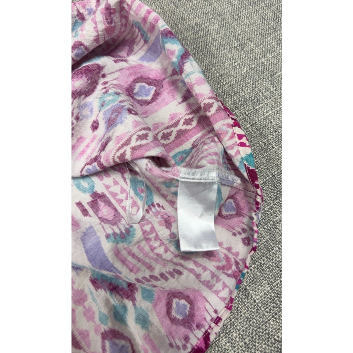 Second Half Supply Co, LLC Savanna Jane tunic blouse fabric tag detail with magenta, purple, and teal geometric print