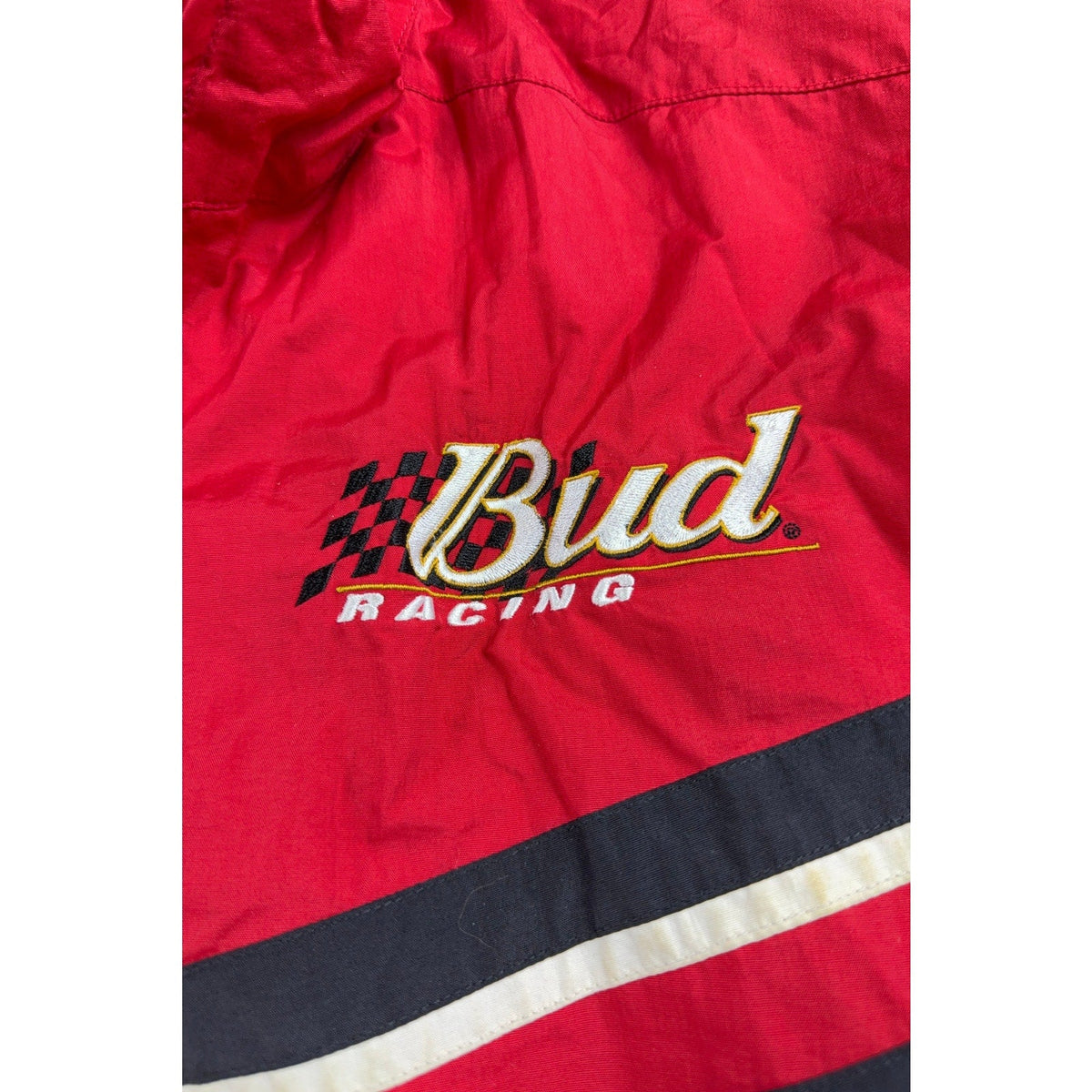 Second Half Supply Co, LLC vintage red nylon NASCAR racing jacket with embroidered Bud Racing logo and checkered flag
