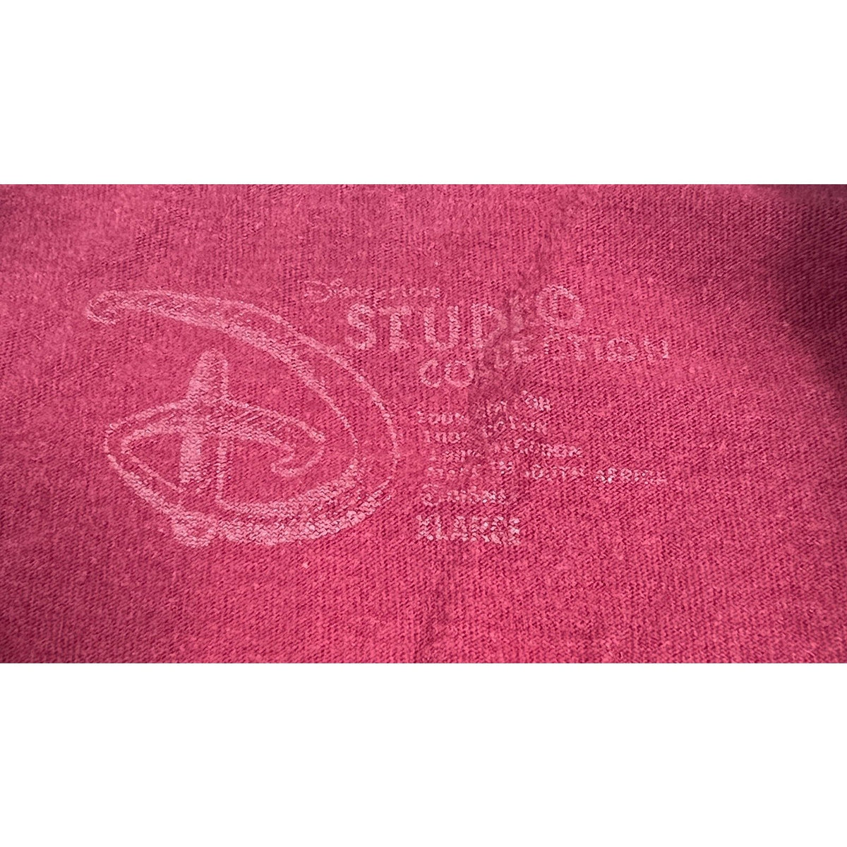 Second Half Supply Co, LLC burgundy cotton graphic tee with faded Disney Store neck label and distressed texture