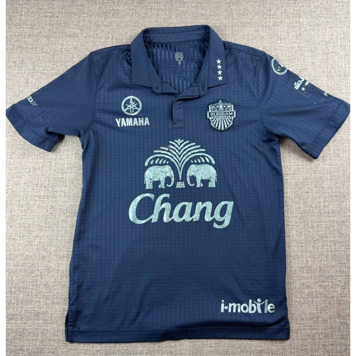 Second Half Supply Co, LLC navy blue Buriram United 2017 home soccer jersey with polo collar and sponsor graphics.