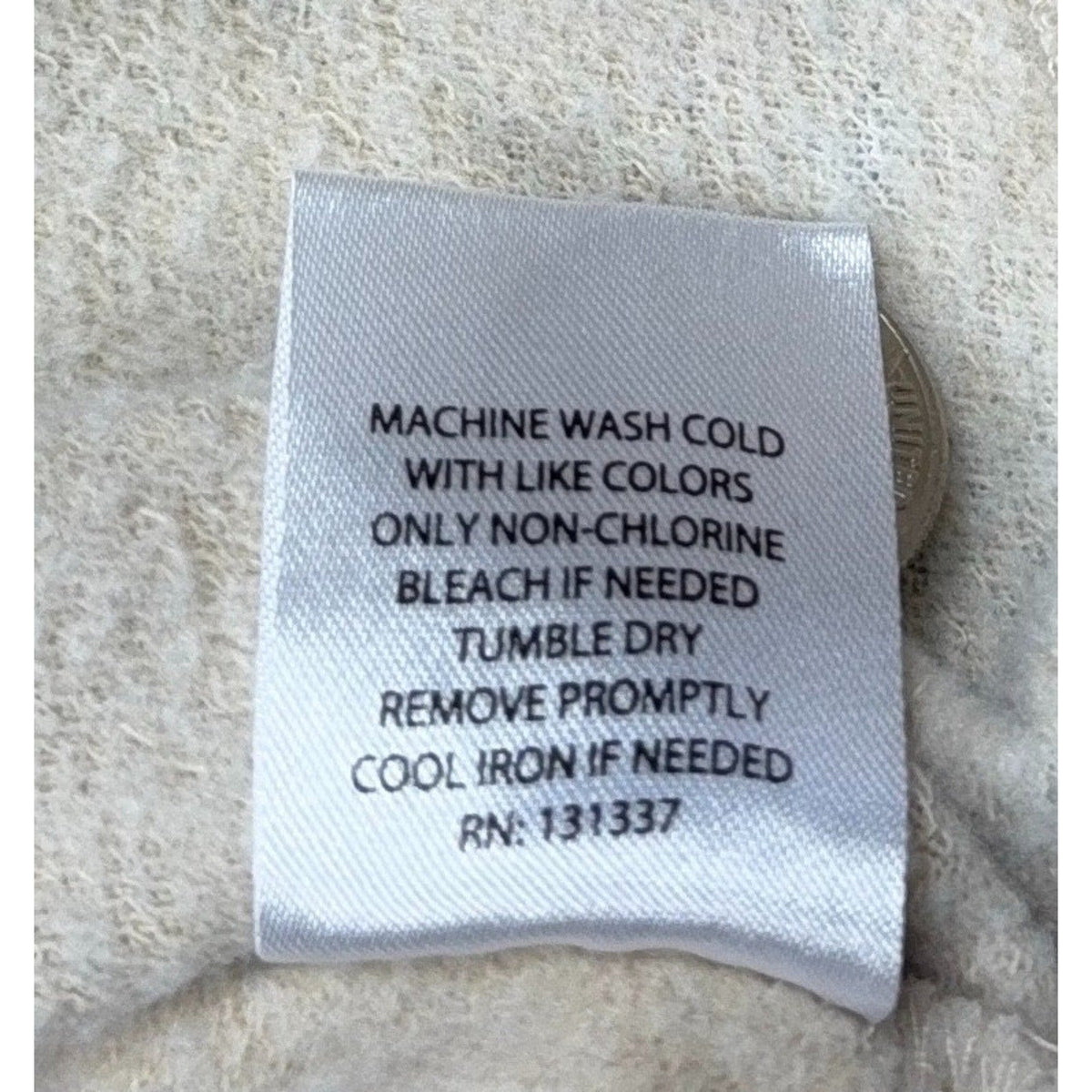 Second Half Supply Co, LLC care instruction tag for a cream Kentucky University sweatshirt with washing guidelines