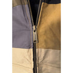 Second Half Supply Co, LLC reworked Carhartt jacket featuring a metal zipper pull on a multicolor patchwork panel
