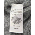Second Half Supply Co, LLC cashmere sweater care label showing material composition and washing instructions