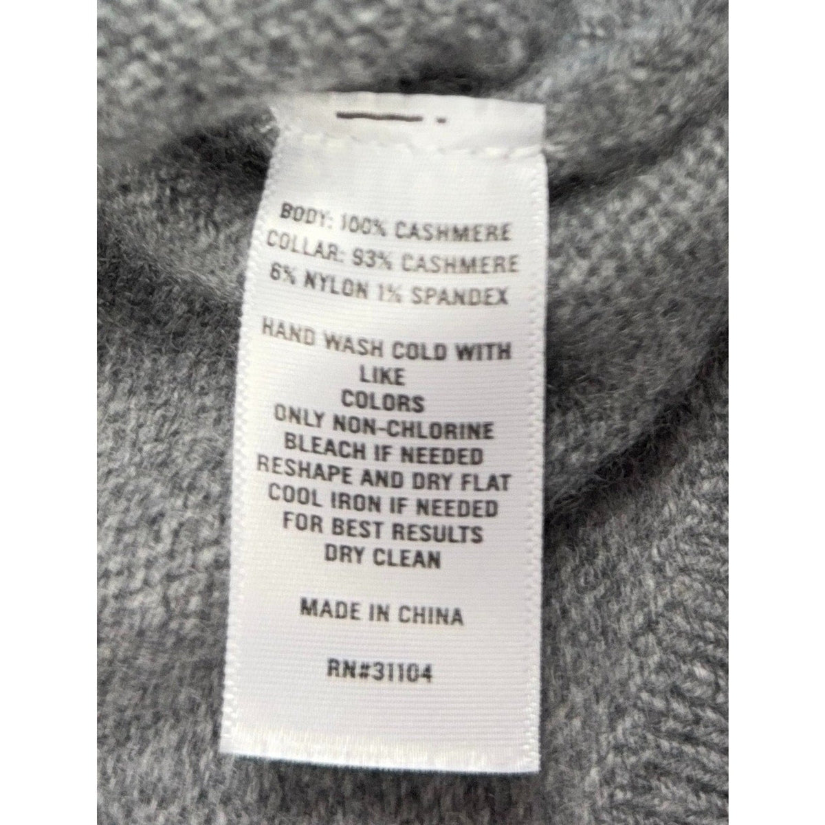 Second Half Supply Co, LLC cashmere sweater care label showing material composition and washing instructions