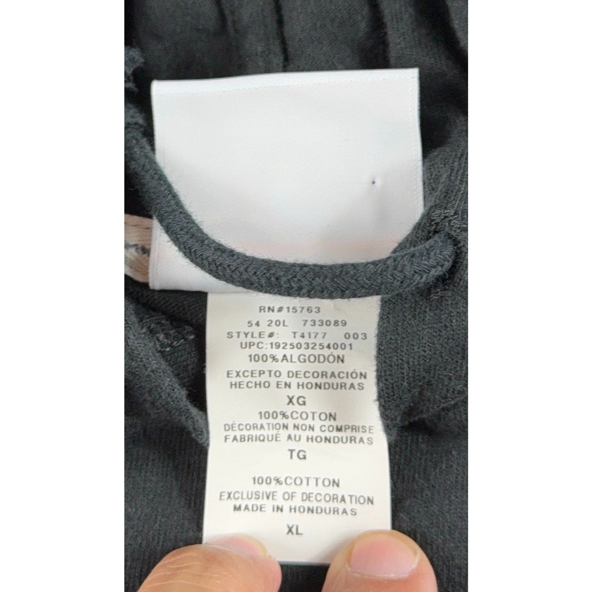 Second Half Supply Co, LLC Champion jersey hoodie interior care label showing 100% cotton material and size XL