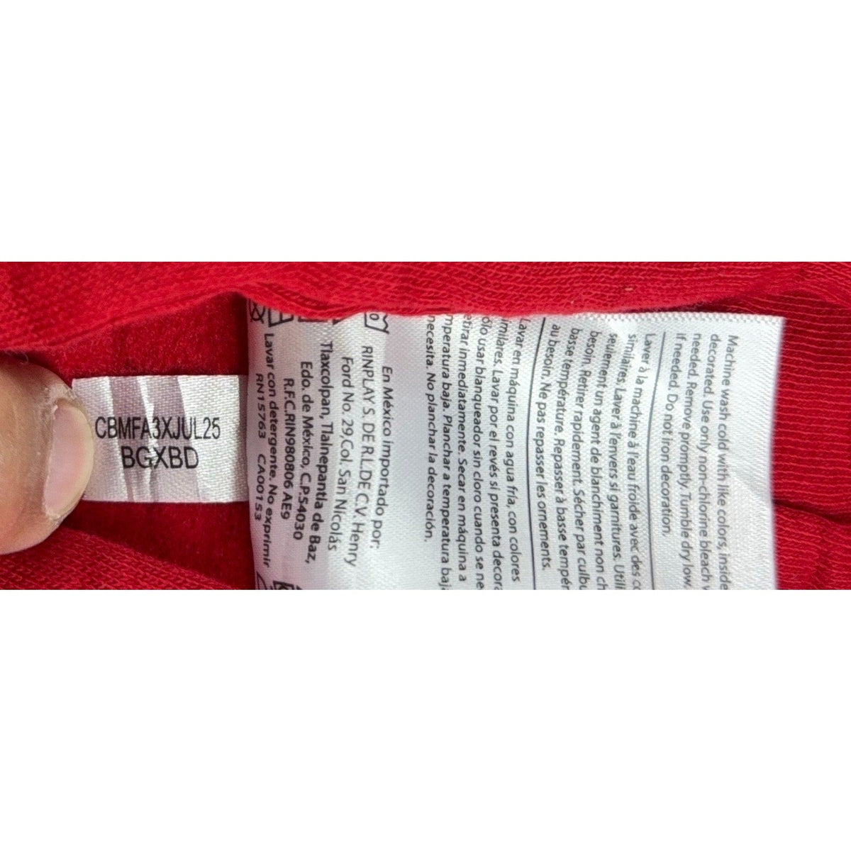 Second Half Supply Co, LLC Champion hoodie care label with washing instructions in English, French, and Spanish.