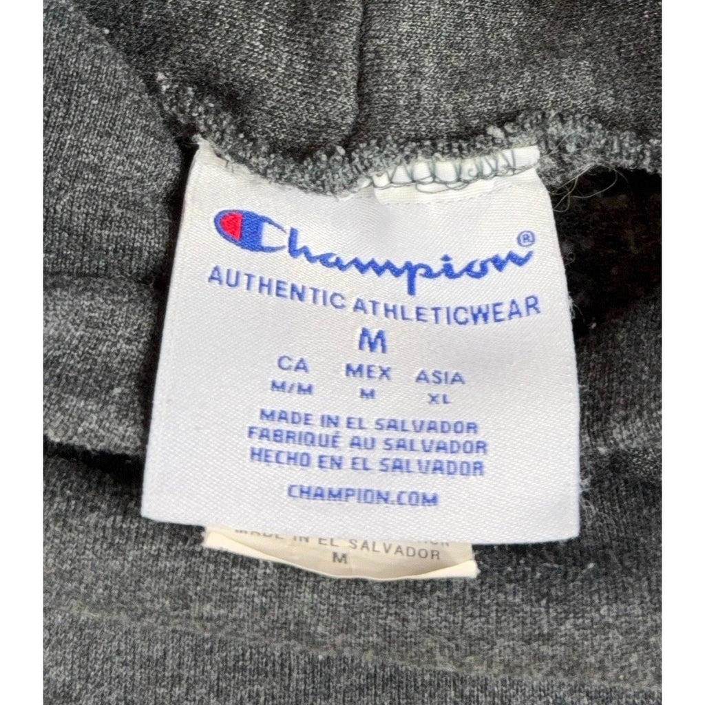 Second Half Supply Co, LLC Champion hoodie size medium tag showing brand logo and manufacturing details