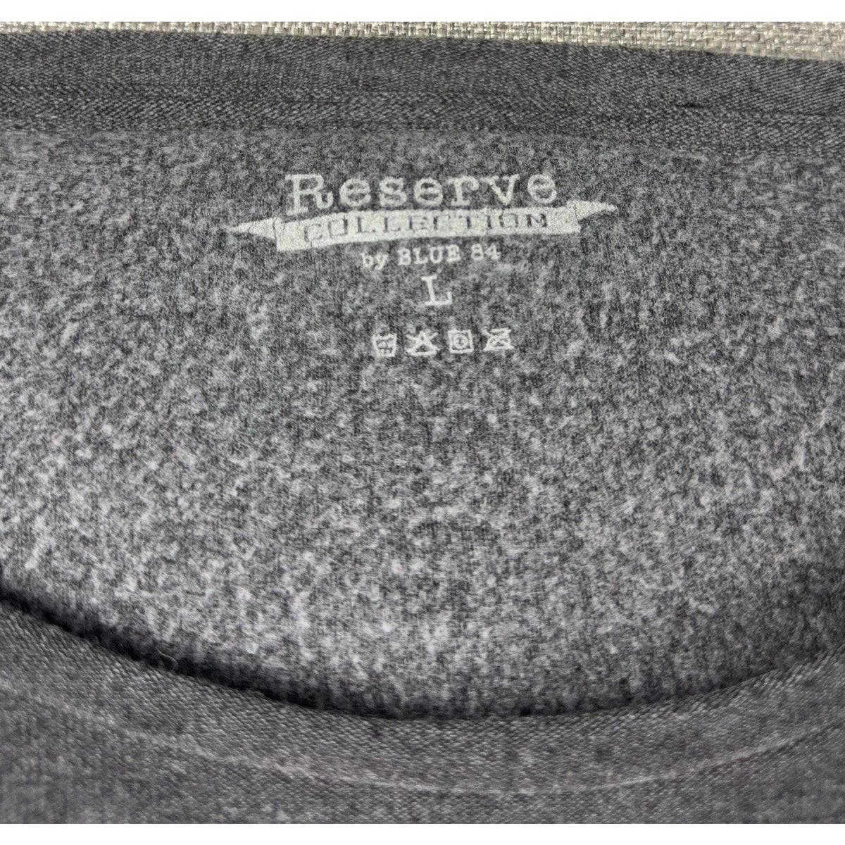 Second Half Supply Co, LLC charcoal gray long sleeve shirt interior neck label with Reserve Collection by Blue 84 logo
