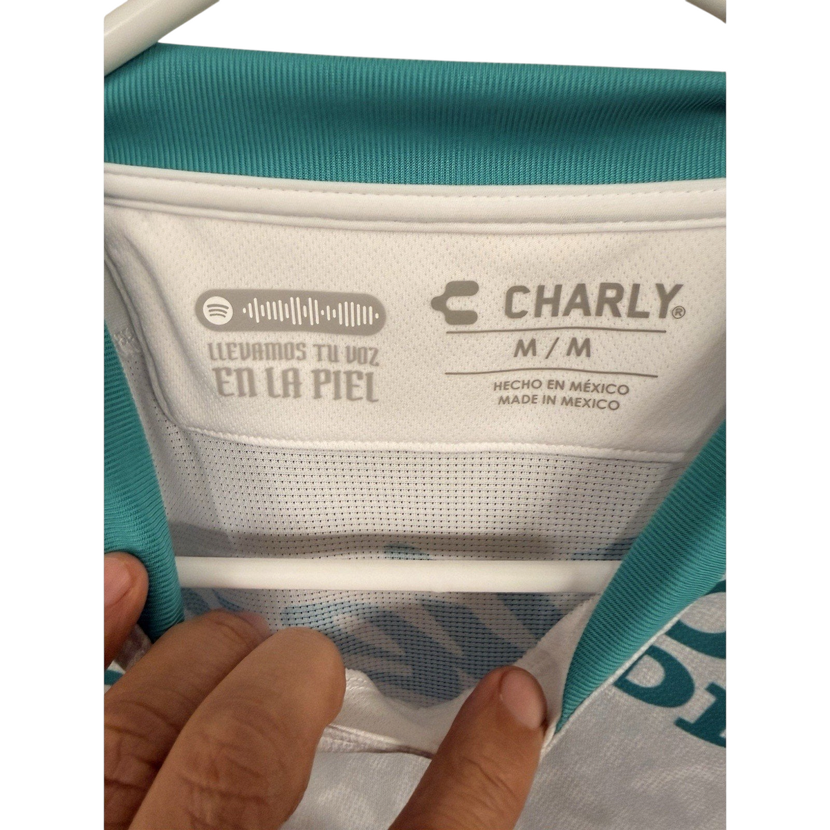 Second Half Supply Co, LLC Charly Club Leon away jersey interior collar tag with teal trim and white mesh fabric