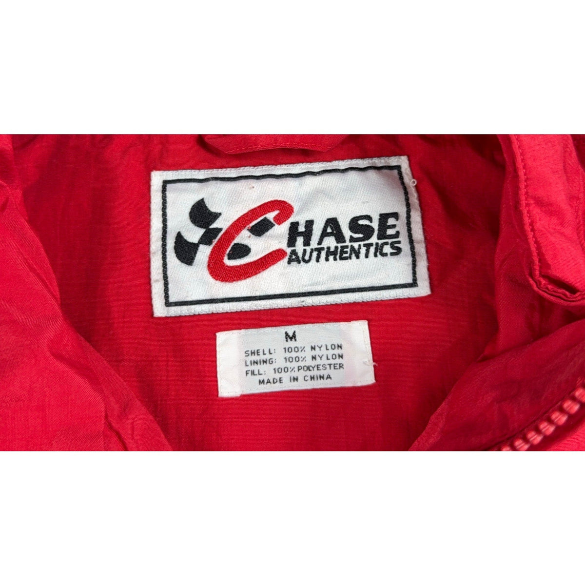 Second Half Supply Co, LLC vintage Chase Authentics NASCAR jacket label showing size M and material composition