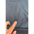 Second Half Supply Co, LLC charcoal gray Chivas soccer hoodie showing a small fabric hole near the kangaroo pocket
