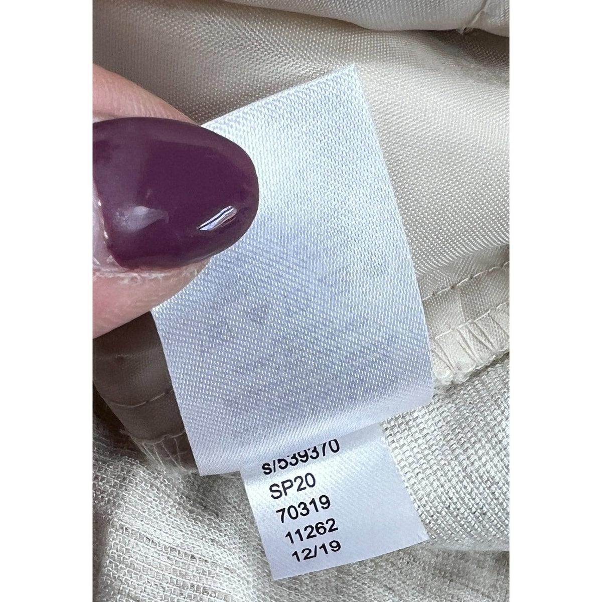 Second Half Supply Co, LLC clothing care tag showing style code and production details for Ann Taylor Factory pants