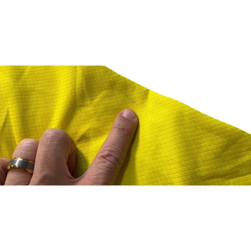 Second Half Supply Co, LLC yellow Adidas Colombia soccer jersey fabric showing a small mark and textured material