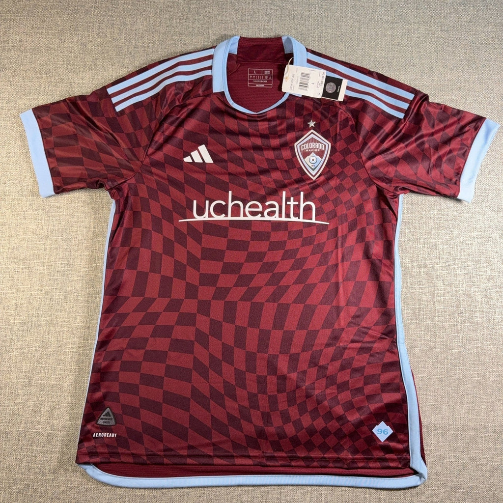 Second Half Supply Co, LLC 2024 Colorado Rapids Adidas authentic soccer jersey in burgundy with sky blue accents