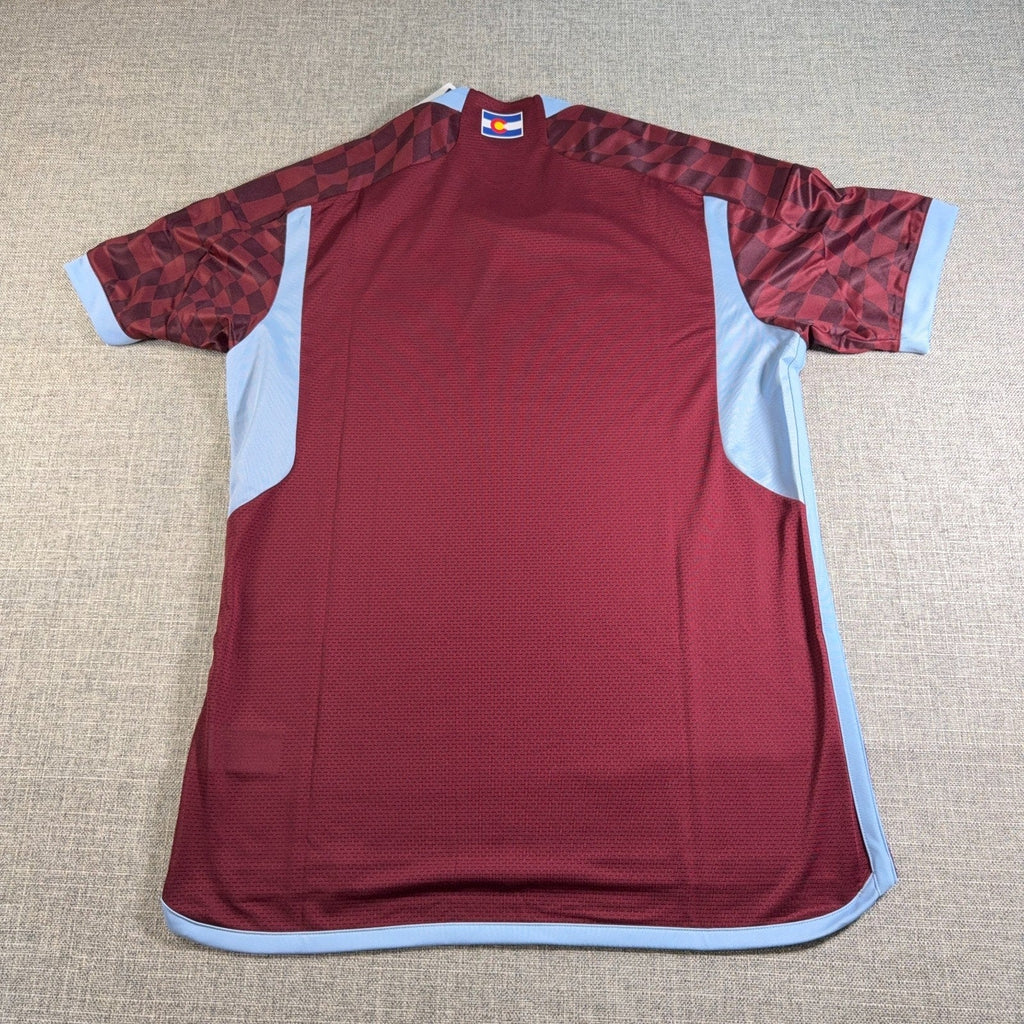 Second Half Supply Co, LLC Colorado Rapids 2024 authentic soccer jersey in burgundy with sky blue accents and flag detail