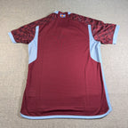 Second Half Supply Co, LLC Colorado Rapids 2024 authentic soccer jersey in burgundy with sky blue accents and flag detail